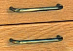 Antique brass drawer pulls.